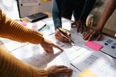 Experts collaborating on wireframes during a user experience audit