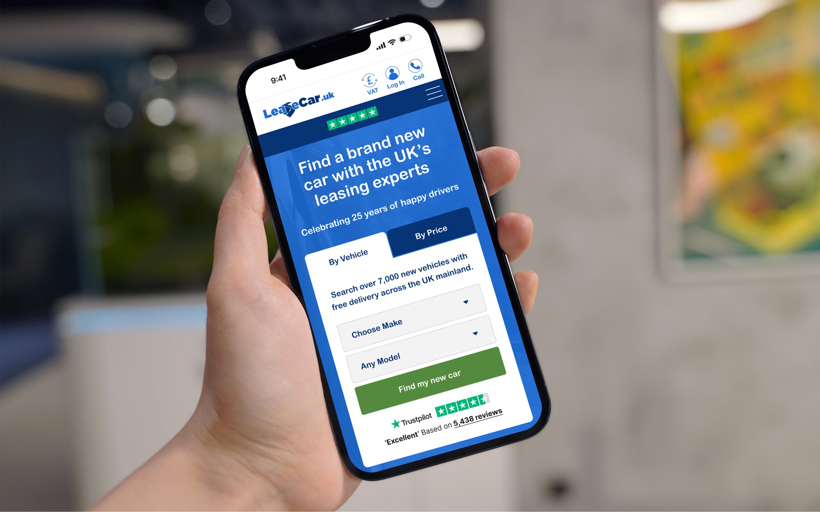 Hand holding smartphone displaying LeaseCar.UK website with car leasing search form and blue interface design