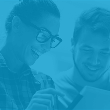 Couple looking at tablet device undertaking user testing